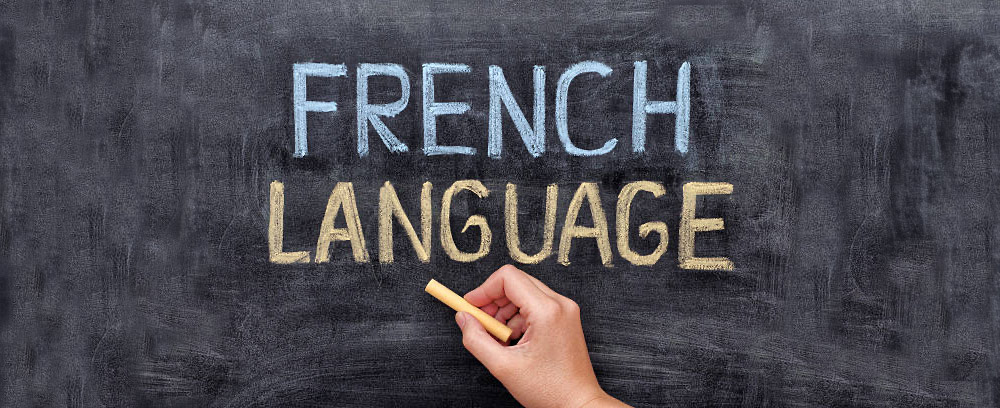 French Language. Hand drawing French Language on blackboard. Close up